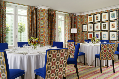 Round dining tables set-up in the Lyric private events room at Covent Garden Hotel