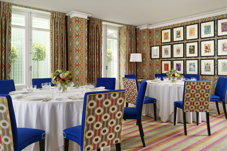 Round dining tables set-up in the Lyric private events room at Covent Garden Hotel