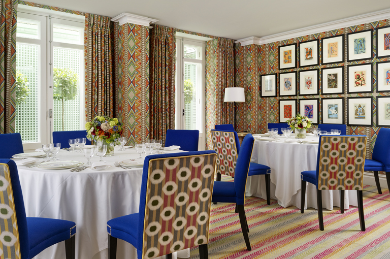 Round dining tables set-up in the Lyric private events room at Covent Garden Hotel