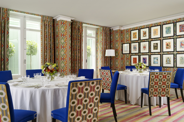 Round dining tables set-up in the Lyric private events room at Covent Garden Hotel