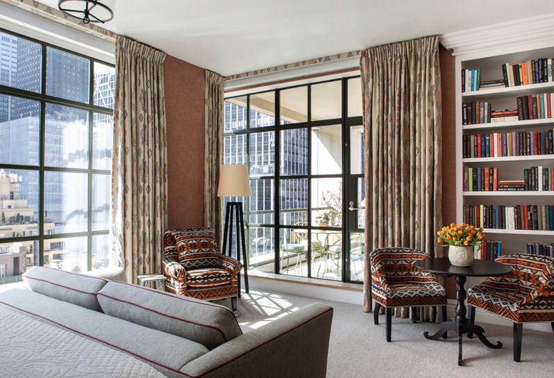 Back of the room and seating area shot of room 1508, a Junior Terrace Suite at The Whitby Hotel