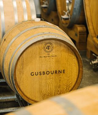 A wide angle close-up shot of the barrels inside the Gusbourne Winery in Kent