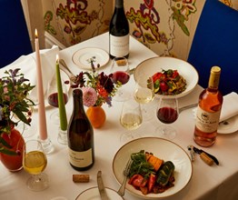 A table setting with wine and candles