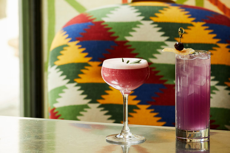 A close up shot of two pink cocktail in The Crosby Bar.