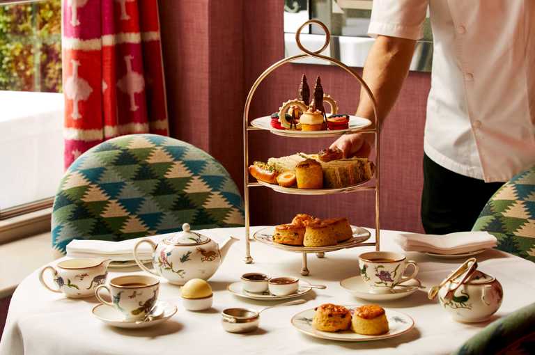 An afternoon tea set up at Brumus in Haymarket Hotel. The cakes are designed to reflect iconic London landmarks