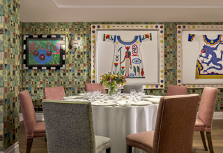 A close shot a round dining table in the Vanessa Bell private events room at Charlotte Street Hotel