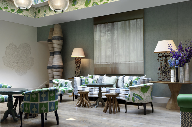 Wide shot of the lounge area of the Conservatory at Haymarket Hotel