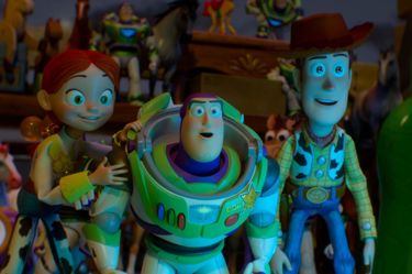 A film still from Toy Story 5, this image shows Buzz, Woody and Jessie all staring in shock off screen.