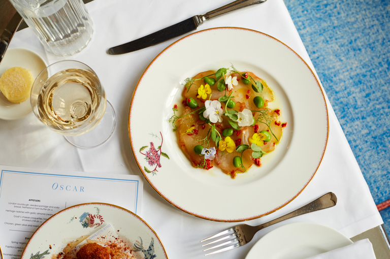 Close up shot of cured cod starter taken from above on a plate at Oscar