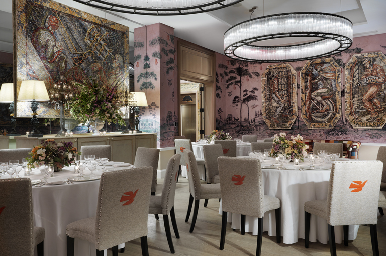 Diagonal shot of round dining tables set-up in the Anrep private events room at The Whitby Hotel