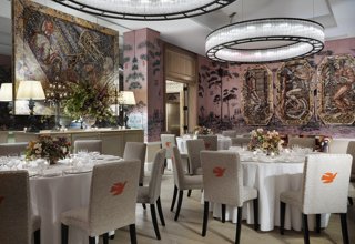 Diagonal shot of round dining tables set-up in the Anrep private events room at The Whitby Hotel