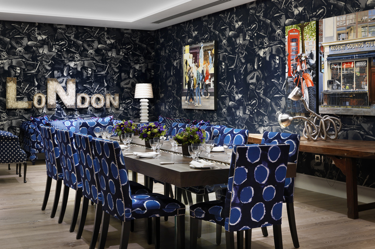 Wide rom shot of a long dining table set-up in the Archer private events room at Ham Yard Hotel