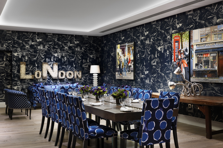 Wide rom shot of a long dining table set-up in the Archer private events room at Ham Yard Hotel