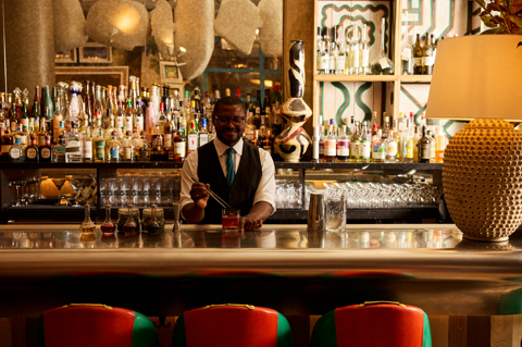 A bartender puts a finishing flourish on a cocktail at Warren Street Bar at Warren Street Hotel New York