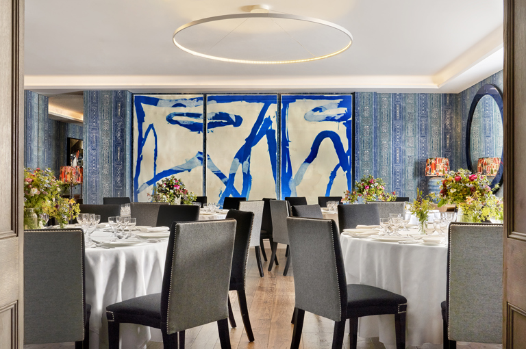 The Indigo Room at The Soho Hotel is set for a seated dinner