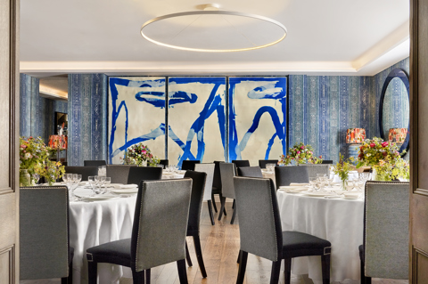 The Indigo Room at The Soho Hotel is set for a seated dinner