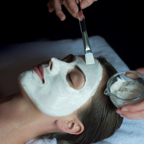 A lady is given a facial in a treatment room at Soholistic Spa at Ham Yard Hotel 