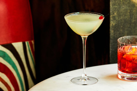 A close up shot of a yellow cocktail in warren street hotel.