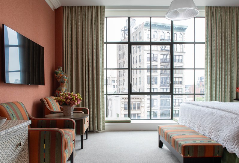 Image of the end of the bed in The Deluxe Room Top Floor, 803, at Crosby Street Hotel.