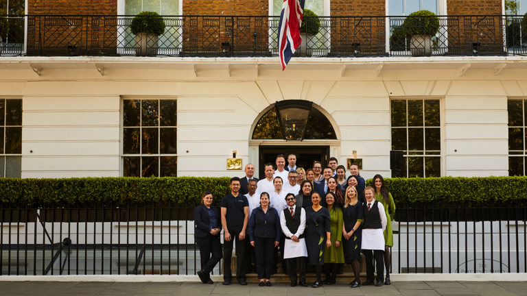 The team at Dorset Square Hotel stand outside the front of the building