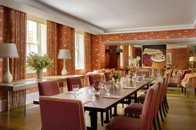 Long meeting table in the Rocklin private events room at Haymarket Hotel