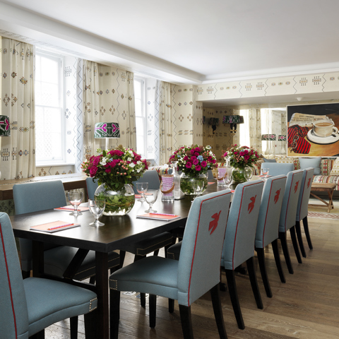Long meeting table in the Rocklin private events room at Haymarket Hotel