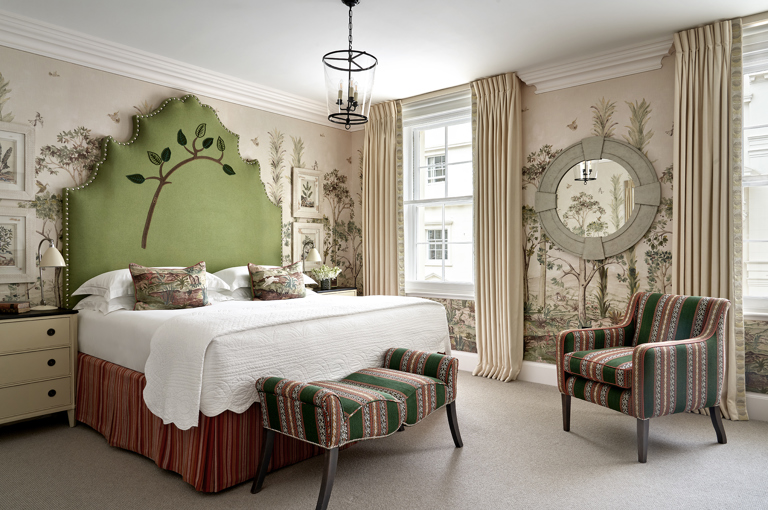 Diagonal shot of the first bedroom in the Two Bedroom Suffolk Suite at Haymarket Hotel