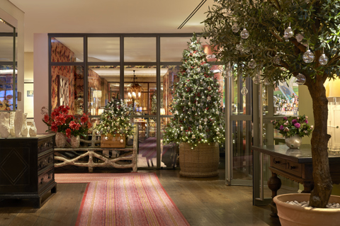 Wide shot of the Christmas tree and decorations in the lobby at The Soho Hotel