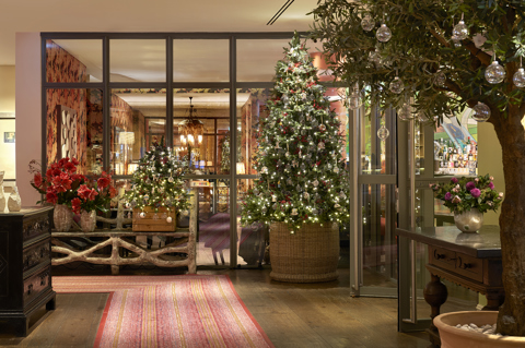 Wide shot of the Christmas tree and decorations in the lobby at The Soho Hotel