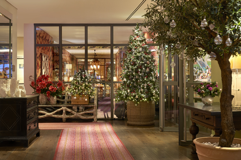 Wide shot of the Christmas tree and decorations in the lobby at The Soho Hotel