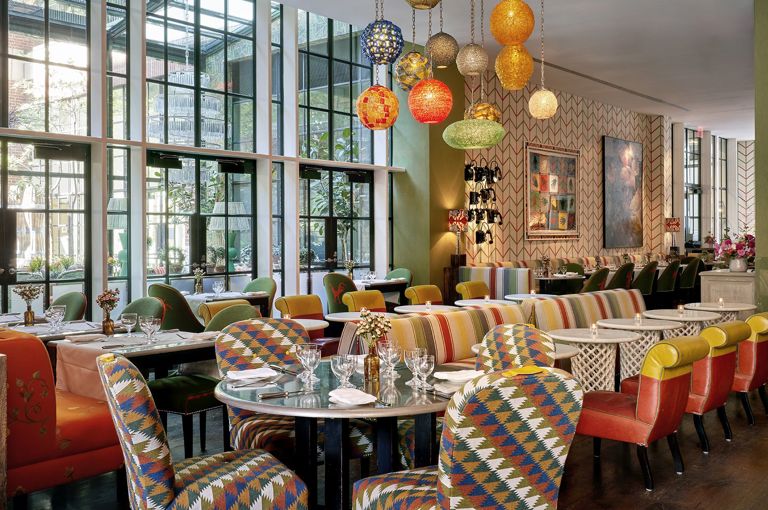 Bar and restaurant area and window onto the Orangery at Crosby Street Hotel