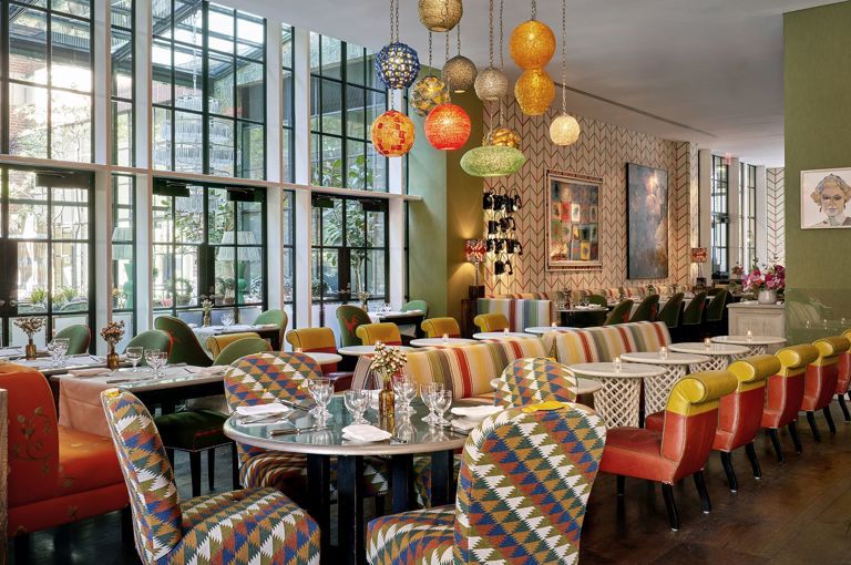 Bar and restaurant area and window onto the Orangery at Crosby Street Hotel