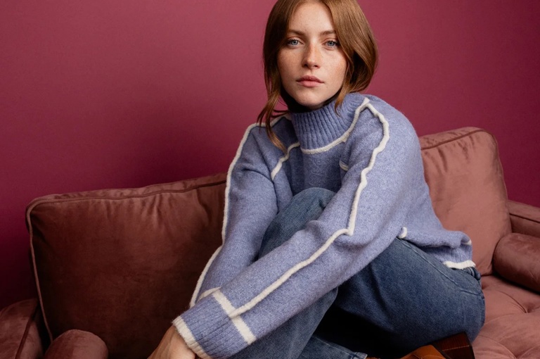 A woman modelling clothes from Ahkeke in Ham Yard Village