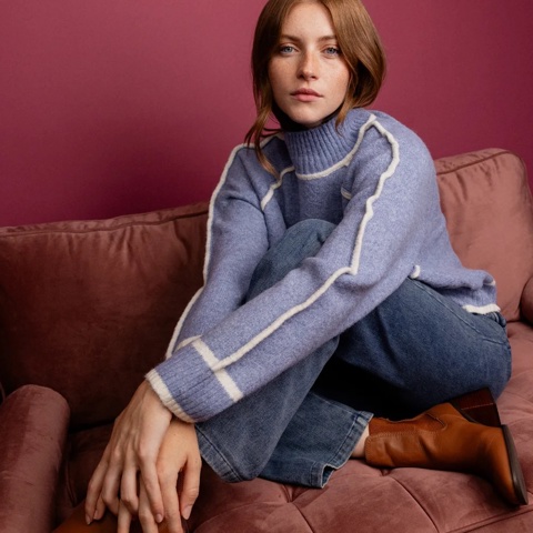 A woman modelling clothes from Ahkeke in Ham Yard Village