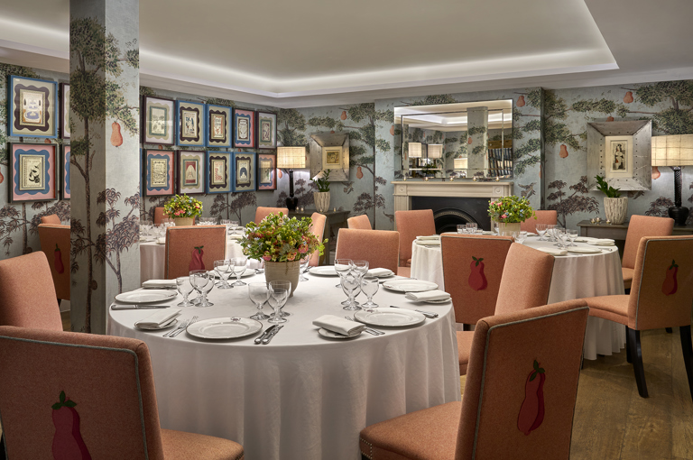 Round dining tables set-up in the Duncan Grant private events room at Charlotte Street Hotel