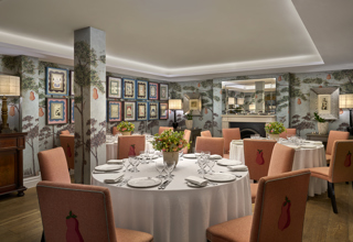 Round dining tables set-up in the Duncan Grant private events room at Charlotte Street Hotel