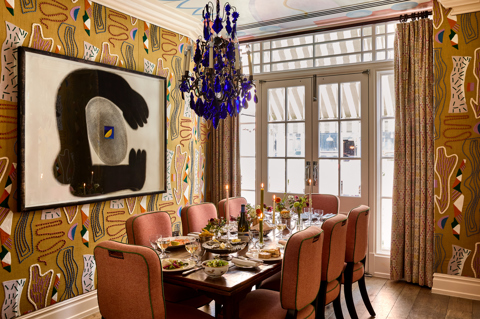A wide shot of the Dora Carrington event space at Charlotte Street Hotel: the table is set up for private dining for eight people with lunch dishes being shared
