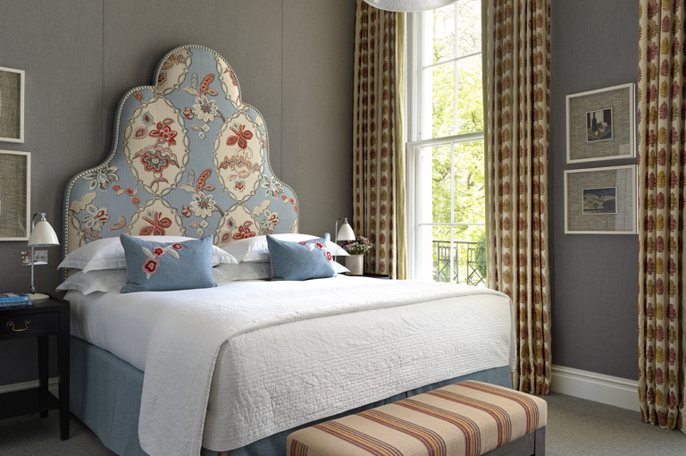 Bedroom shot of room 102, a Deluxe King Room at Dorset Square Hotel