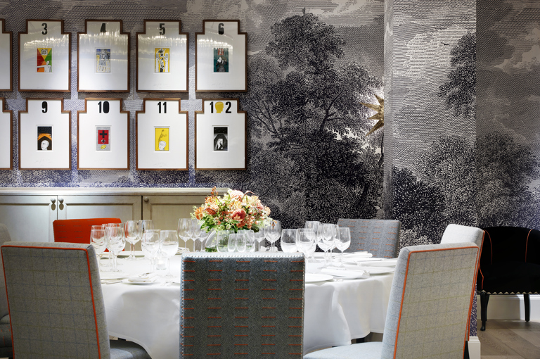 Close shot of a round dining table set-up in the Windmill private events room at Ham Yard Hotel