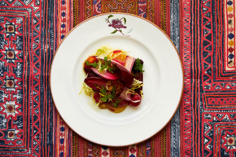 An image of a salad dish on a plate, from the A La Carte Menu at Refuel, Soho Hotel.