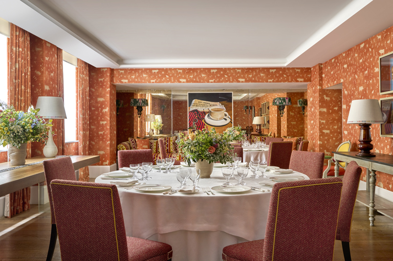 A close up shot of a round table set up for private dining in the Rocklin Room at Haymarket Hotel