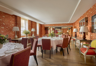 Day shot of a three round tables set up for private dining in the Rocklin Room at Haymarket Hotel