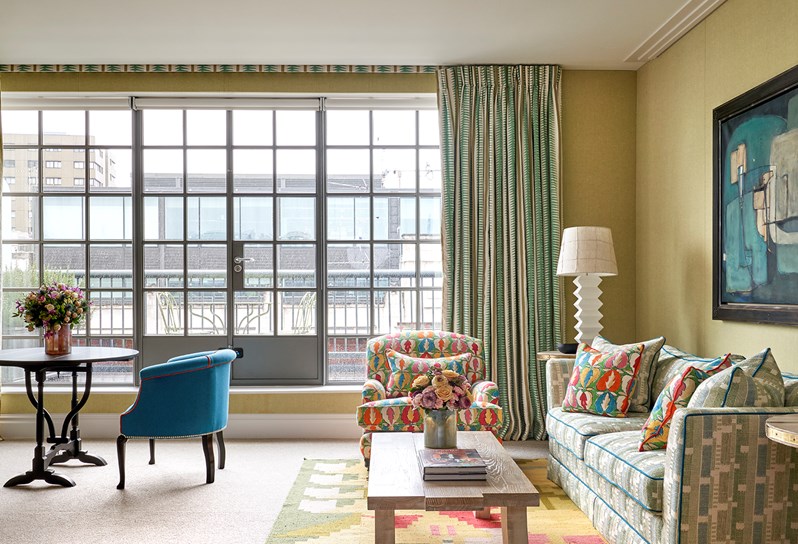 The living room area of the Soho Suite at The Soho Hotel