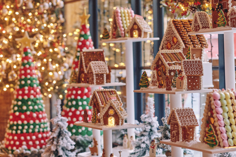 A portrait close up image of the multi teared gingerbread village at Ham Yard Hotel.