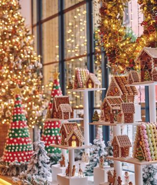 A portrait close up image of the multi teared gingerbread village at Ham Yard Hotel.  