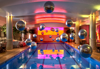 Wide shot of large balloons above the Swimming pool private events room at Haymarket Hotel