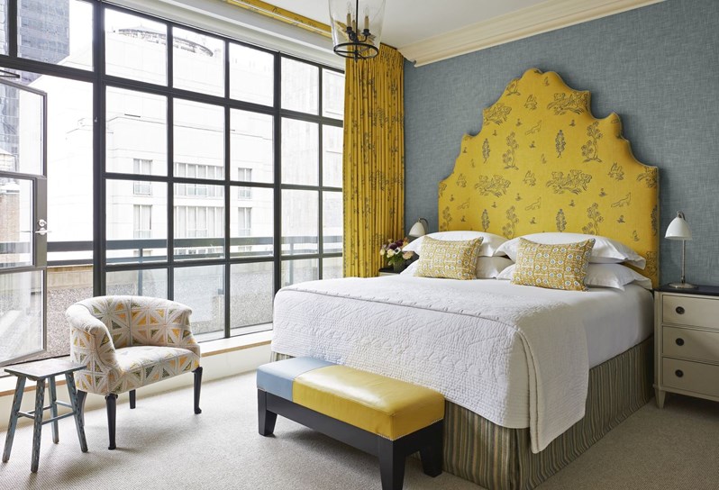 A yellow themed bedroom at The Whitby Hotel, New York