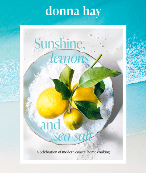 The book jacket for 'Sunshine, Lemons and Sea Salt' cook book by Donna Hay, which displays an image of lemons in a bowl of salt