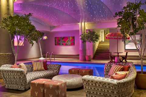 A sitting area next to the swimming pool at Haymarket Hotel