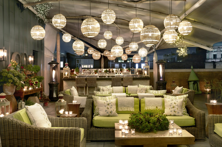 Night wide shot of the Roof Terrace at Ham Yard Hotel